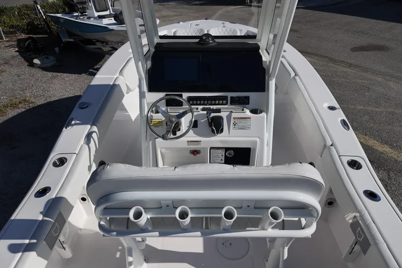 Slide: The Image of 2026 Sea Fox 228 Commander boat cockpit with steering wheel and control panel. - 7