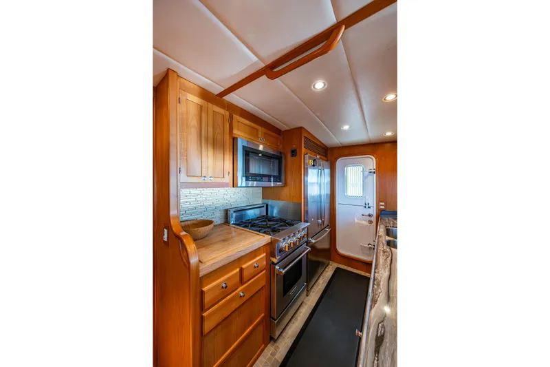 Slide: The Image of In-line galley with aluminum weather-tight door leading to the starboard side deck - 14