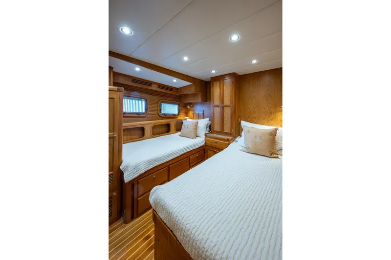 Slide: The Image of Guest cabin with twin berths and large opening stainless steeel ports - 25