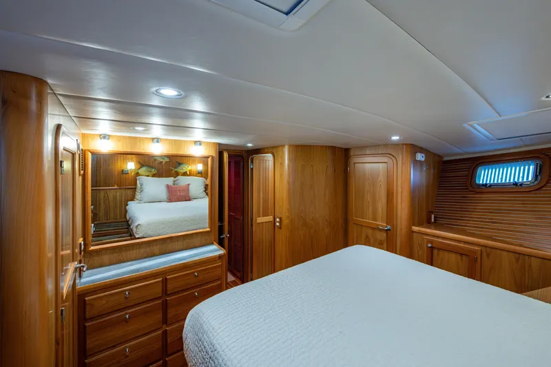 Slide: The Image of Master stateroom mirrored vanity and draw storage, port side handing locker and en suite head entrance - 33