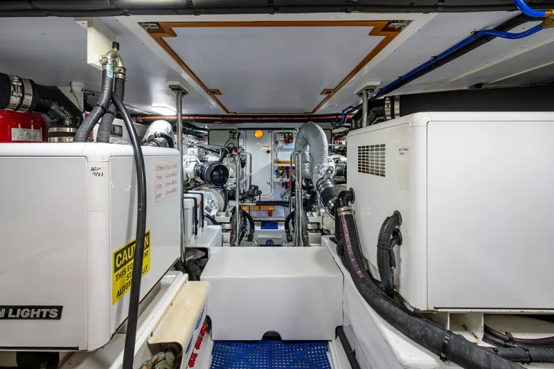 Slide: The Image of Engine room looking forward from the lazarette. 6 Kw generator to the left, 12 kw generator to the right - 60