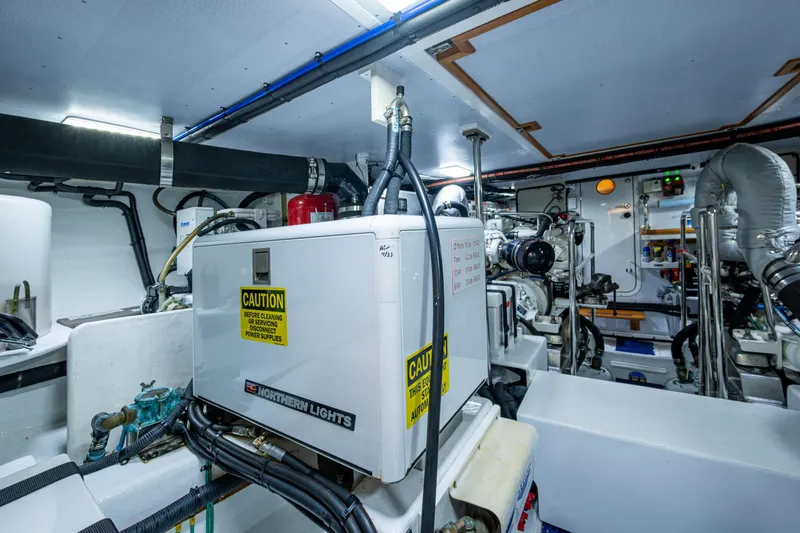 Slide: The Image of Port side of the engine room and the 6 kw generator - 61