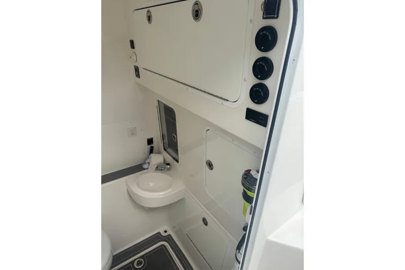 Slide: The Image of 2024 Invincible 39 Open Fisherman boat interior with sink and storage compartments. - 10