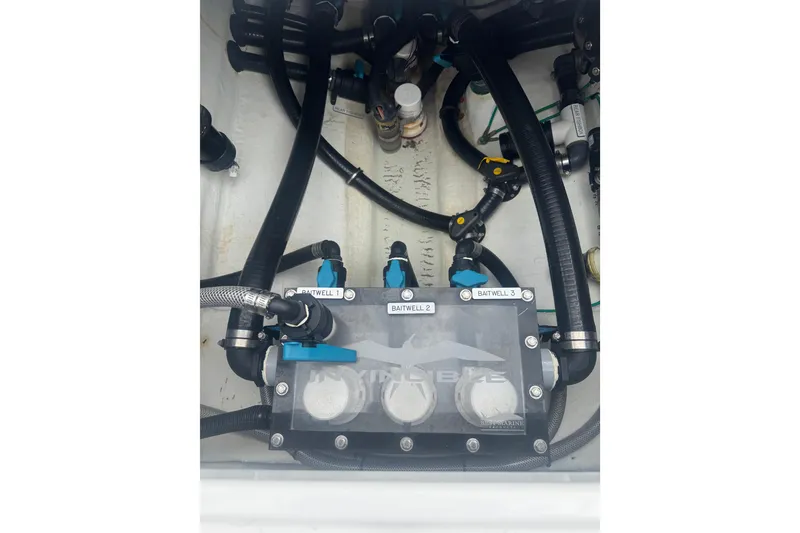 Slide: The Image of 2024 Invincible 39 Open Fisherman boat plumbing system with labeled baitwell connections. - 11