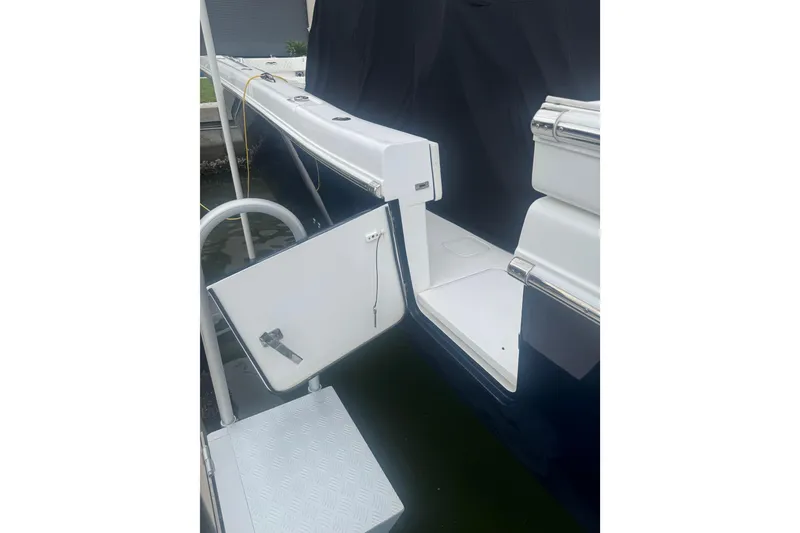 Slide: The Image of 2024 Invincible 39 Open Fisherman boat with open side door and step ladder. - 15