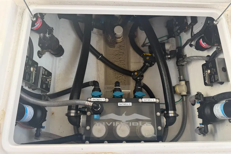 Slide: The Image of 2024 Invincible 39 Open Fisherman boat plumbing system with labeled baitwell connections. - 29