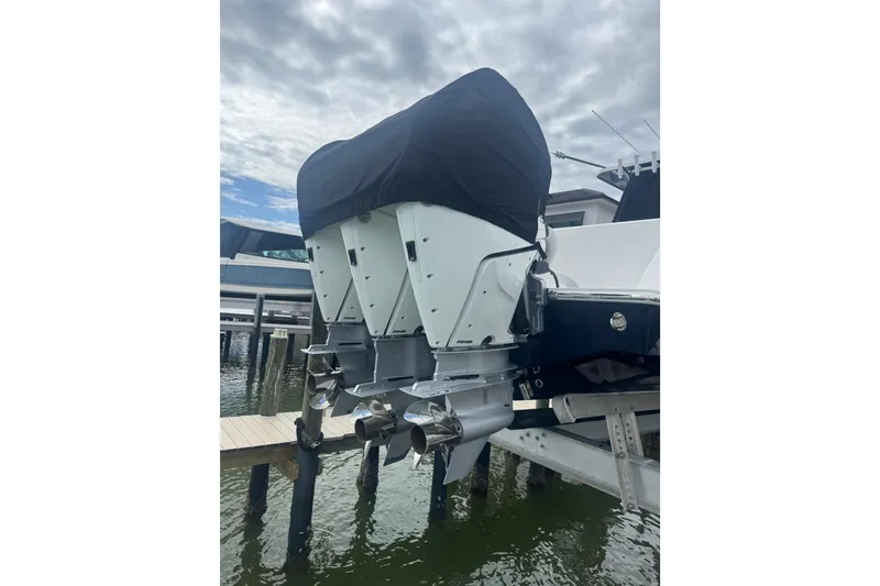 Slide: The Image of 2024 Invincible 39 Open Fisherman boat with covered outboard engines at dock. - 3