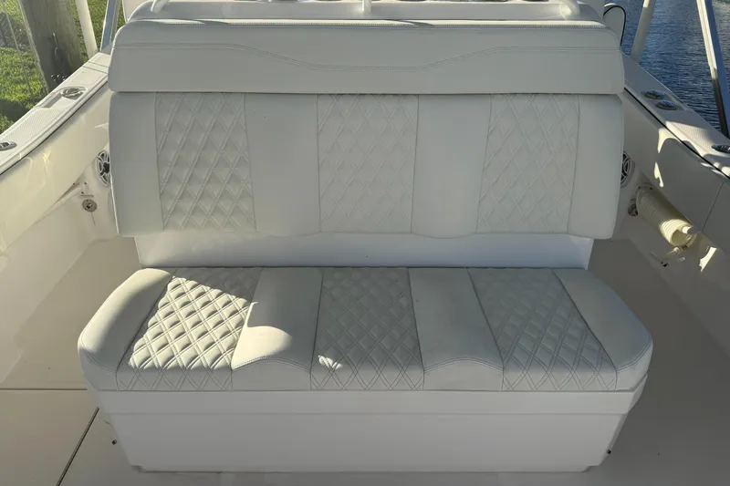 Slide: The Image of 2024 Invincible 39 Open Fisherman boat seat with diamond-patterned upholstery. - 30