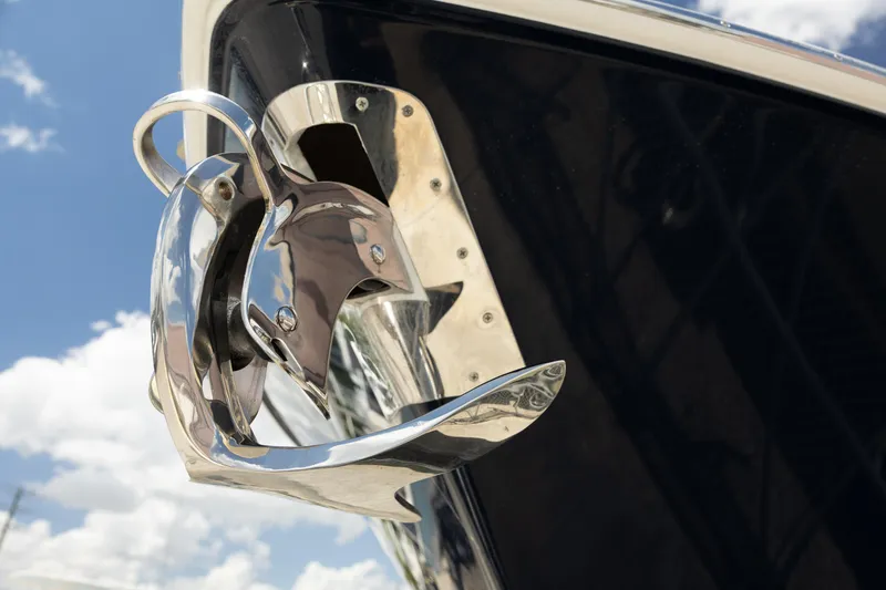 Slide: The Image of Close-up of a 2024 Invincible 39 Open Fisherman boat anchor against a blue sky. - 40