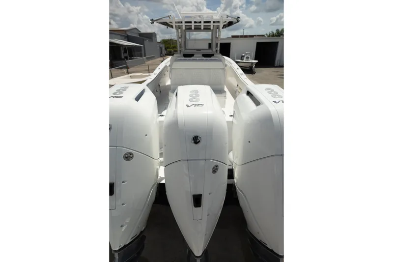 Slide: The Image of 2024 Invincible 39 Open Fisherman boat with triple outboard engines. - 45