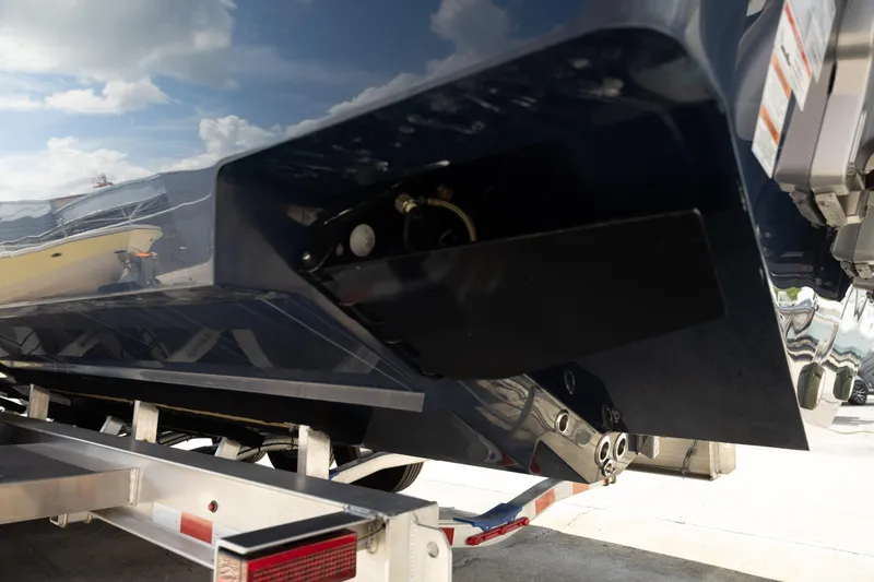 Slide: The Image of 2024 Invincible 39 Open Fisherman boat on trailer, showcasing hull and engine details. - 46