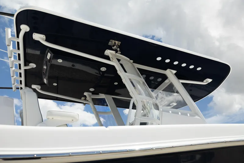 Slide: The Image of 2024 Invincible 39 Open Fisherman boat with sleek T-top design against cloudy sky. - 47