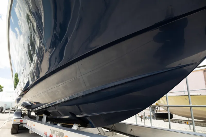 Slide: The Image of 2024 Invincible 39 Open Fisherman boat hull on trailer, showcasing sleek design and craftsmanship. - 48