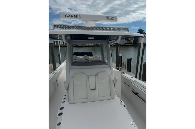 Slide: The Image of 2024 Invincible 39 Open Fisherman boat with Garmin radar, docked by the water. - 5