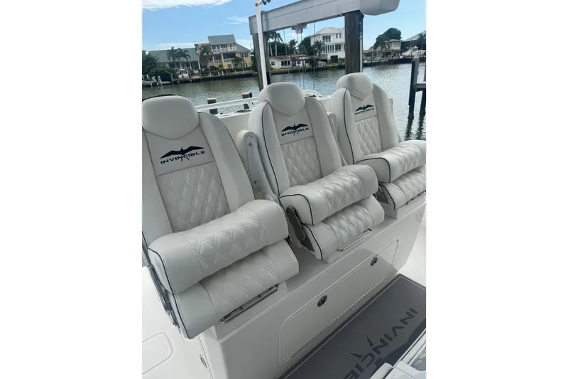 Slide: The Image of 2024 Invincible 39 Open Fisherman boat seats with luxurious white upholstery. - 9