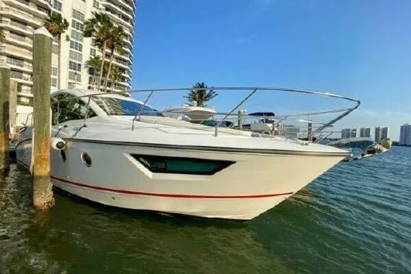 Slide: The Image of 2019 Beneteau Gran Turismo 40 yacht docked near waterfront buildings. - 16