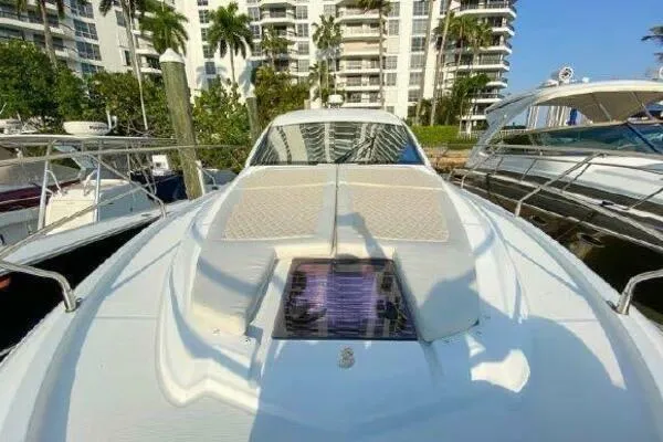 Slide: The Image of 2019 Beneteau Gran Turismo 40 yacht docked, with sunbathing area and modern design. - 19