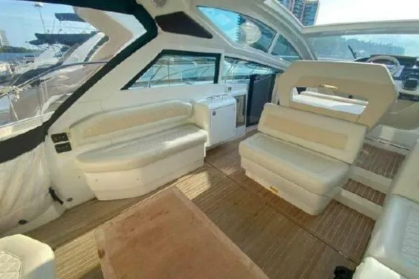 Slide: The Image of 2019 Beneteau Gran Turismo 40 yacht interior with white seating and wooden flooring. - 2