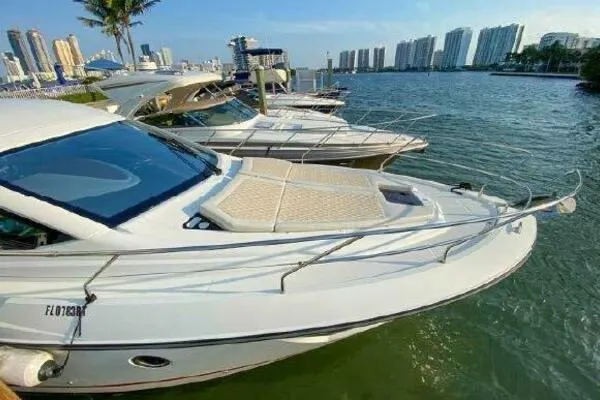Slide: The Image of 2019 Beneteau Gran Turismo 40 yacht docked in a marina with city skyline. - 20