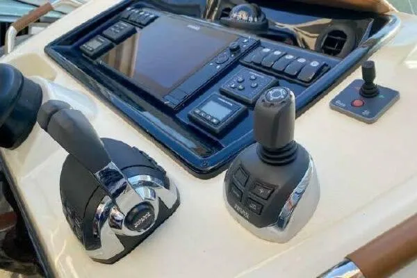 Slide: The Image of Control panel of 2019 Beneteau Gran Turismo 40 yacht with joystick and throttle. - 23