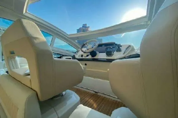 Slide: The Image of 2019 Beneteau Gran Turismo 40 cockpit with modern steering and plush seating. - 24