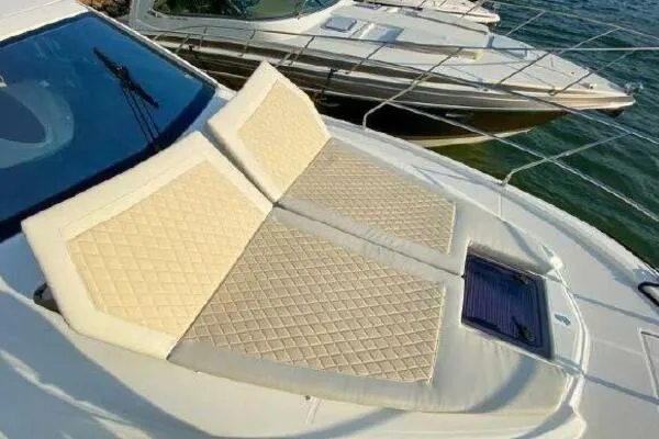 Slide: The Image of 2019 Beneteau Gran Turismo 40 yacht with sunbathing cushions on deck. - 25