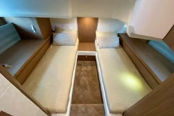 Slide: The Image of 2019 Beneteau Gran Turismo 40 cabin with twin beds and modern interior design. - 3