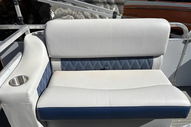 Slide: The Image of White and blue boat seat with cup holders, Pond-Tini Series 12, 2025 model. - 15
