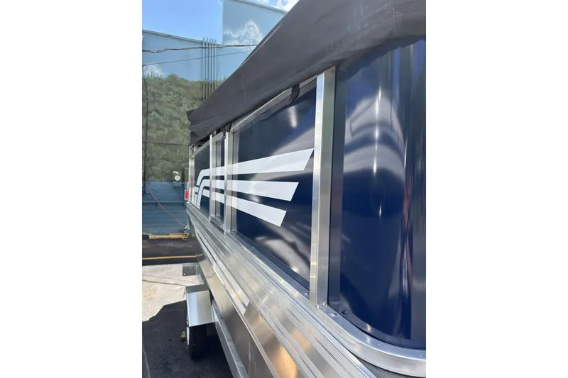 Slide: The Image of 2025 Pond-Tini Series 12 (Smoke Rise) boat with sleek blue and white design. - 17