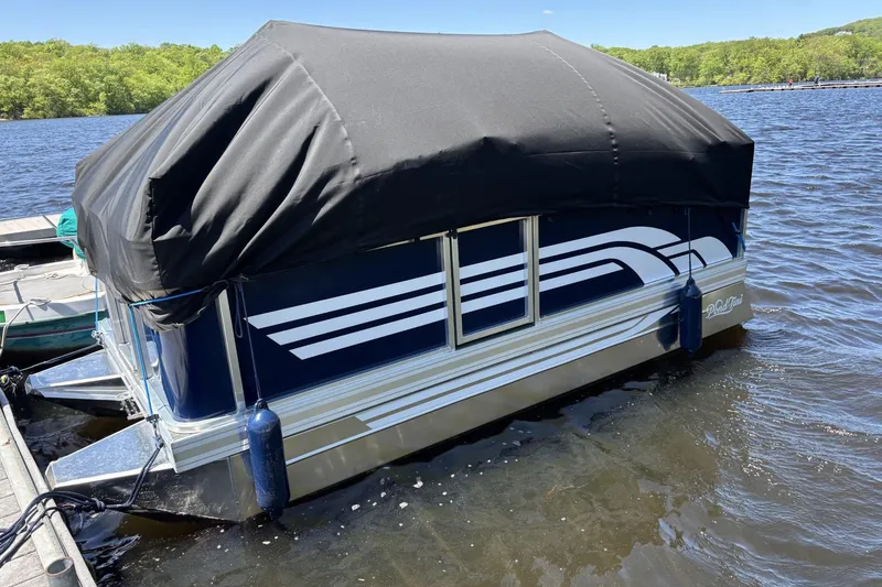 Slide: The Image of 2025 Pond-Tini Series 12 (Smoke Rise) pontoon boat with black cover on a lake. - 19