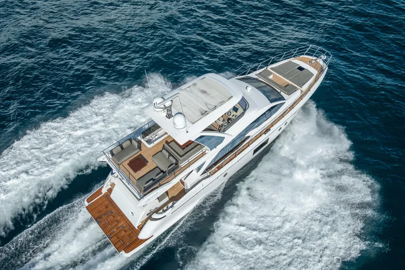 Slide: The Image of Luxurious 2019 Azimut 66 yacht cruising on open sea, aerial view. - 10
