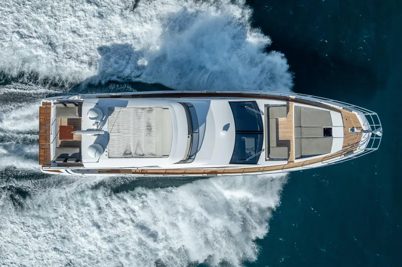 Slide: The Image of Aerial view of 2019 Azimut 66 yacht cruising on open water. - 11