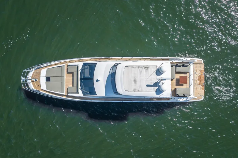 Slide: The Image of Aerial view of 2019 Azimut 66 yacht on calm green water. - 17