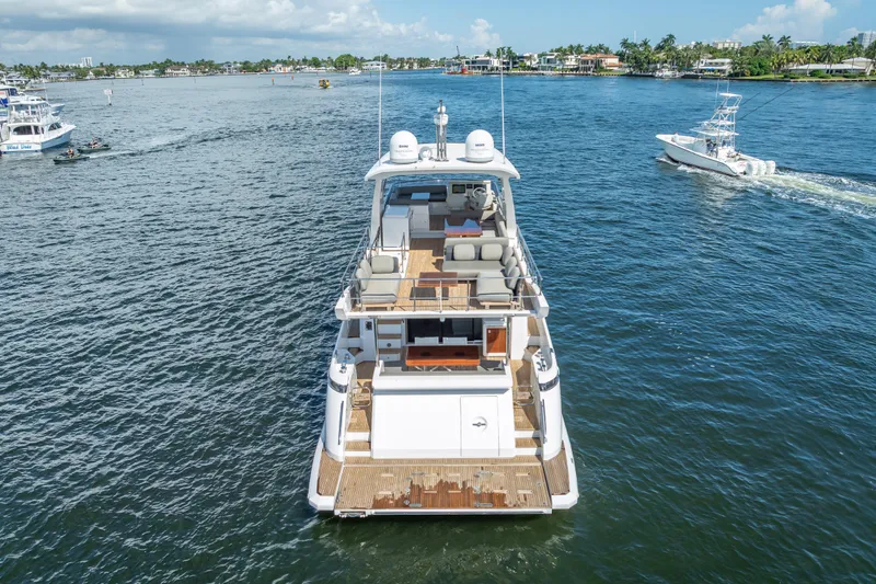 Slide: The Image of 2019 Azimut 66 yacht cruising on a sunny day in a scenic waterway. - 20