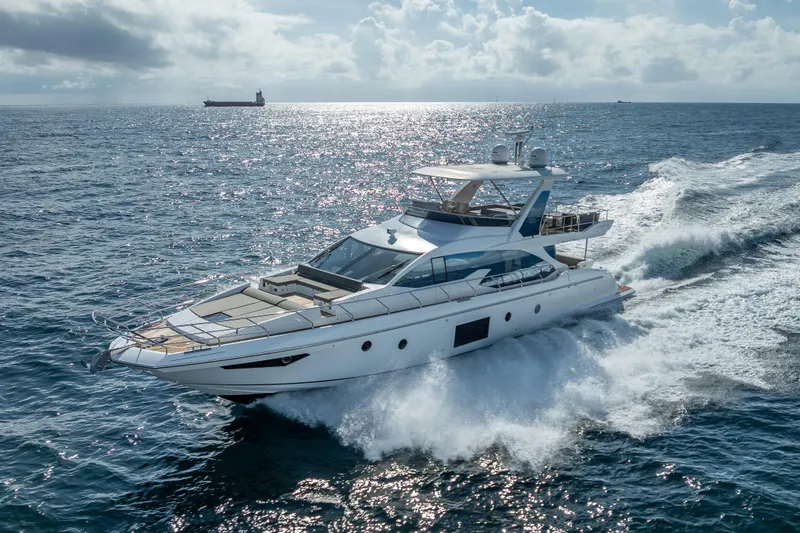 Slide: The Image of Luxurious 2019 Azimut 66 yacht cruising on open sea under a cloudy sky. - 3
