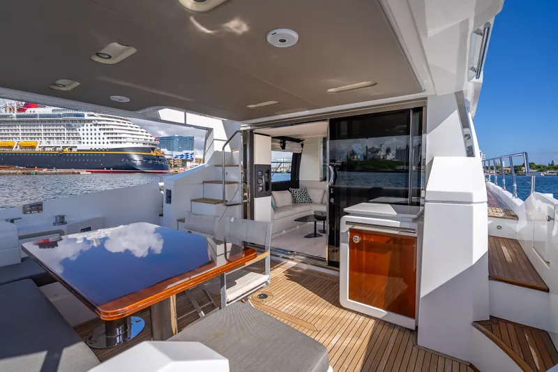 Slide: The Image of Luxurious 2019 Azimut 66 yacht interior with elegant seating and ocean view. - 34