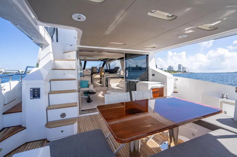 Slide: The Image of Luxurious 2019 Azimut 66 yacht interior with elegant dining area and ocean view. - 36