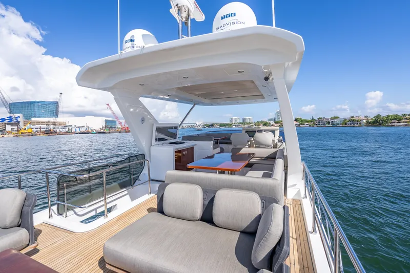 Slide: The Image of Luxurious 2019 Azimut 66 yacht with spacious deck and elegant seating on a sunny day. - 38