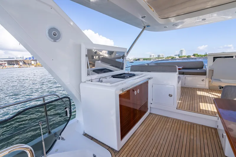 Slide: The Image of Luxurious 2019 Azimut 66 yacht deck with outdoor kitchen and seating area. - 41