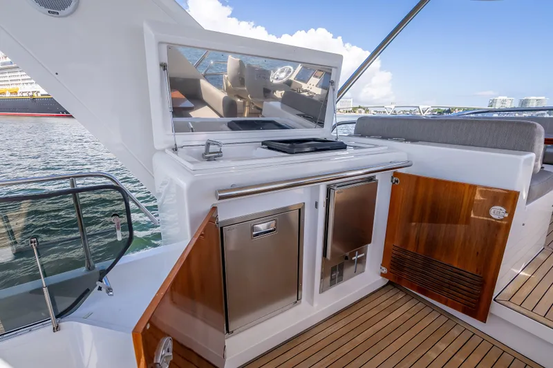 Slide: The Image of Luxurious 2019 Azimut 66 yacht deck with outdoor kitchen and seating area. - 42
