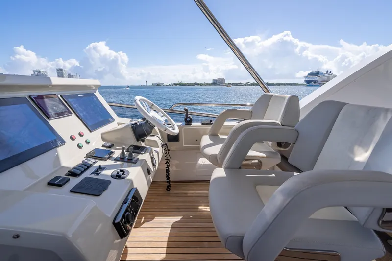 Slide: The Image of Luxurious 2019 Azimut 66 yacht helm with modern controls and ocean view. - 46
