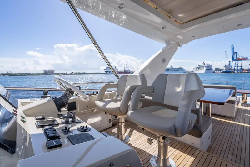 Slide: The Image of Luxurious 2019 Azimut 66 yacht helm with plush seating and ocean view. - 47