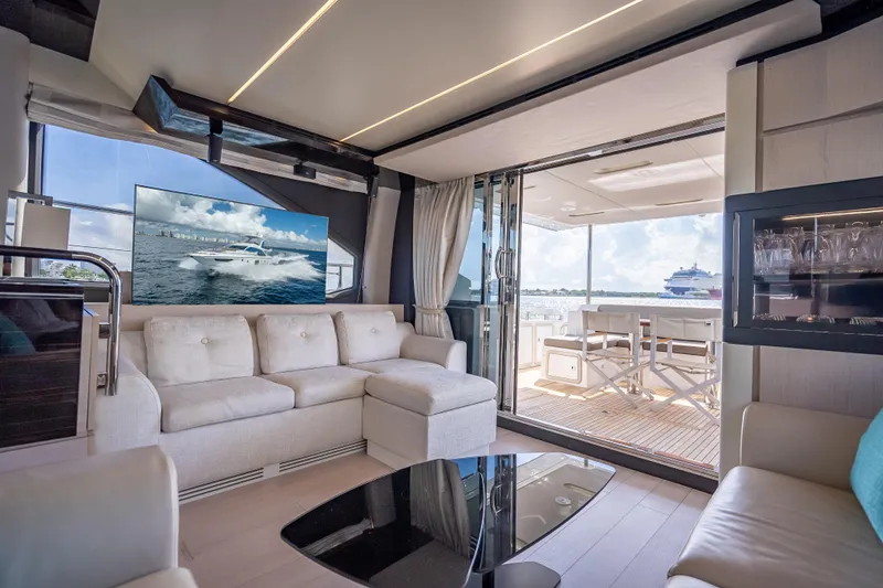 Slide: The Image of Luxurious interior of 2019 Azimut 66 yacht with modern seating and ocean view. - 53