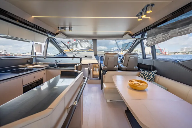 Slide: The Image of Luxurious interior of 2019 Azimut 66 yacht with modern kitchen and dining area. - 57