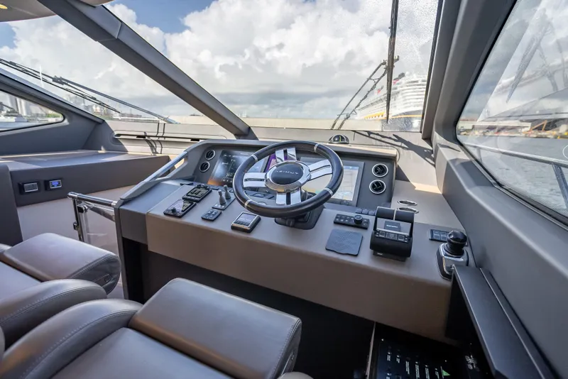 Slide: The Image of 2019 Azimut 66 yacht helm with modern controls and panoramic view. - 65