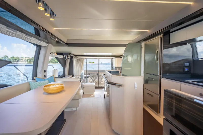 Slide: The Image of Luxurious interior of 2019 Azimut 66 yacht with modern kitchen and dining area. - 70