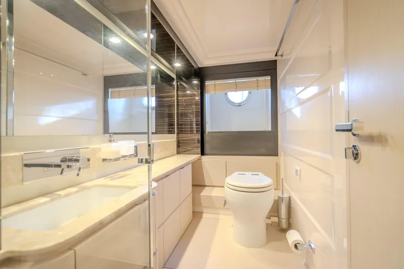 Slide: The Image of Luxurious bathroom interior of 2019 Azimut 66 yacht, featuring modern fixtures and elegant design. - 80