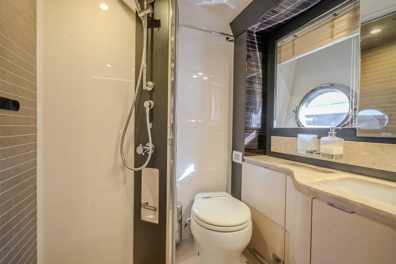 Slide: The Image of Luxurious bathroom in 2019 Azimut 66 yacht with modern shower and porthole window. - 83