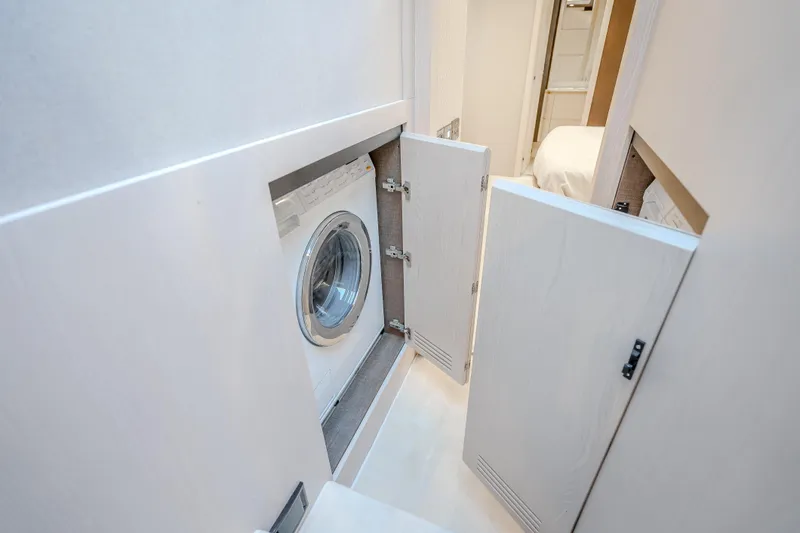 Slide: The Image of Laundry area with washing machine in 2019 Azimut 66 yacht interior. - 84