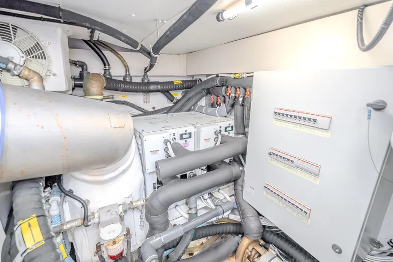 Slide: The Image of Engine room of 2019 Azimut 66 yacht with electrical panels and piping. - 93